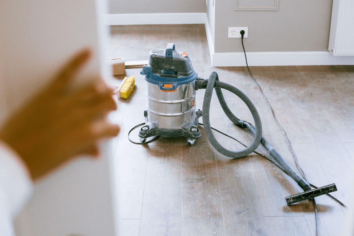 Construction dust being cleaned off a new kitchen
